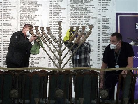 Polish far-right lawmaker extinguishes Hanukkah candle in parliament